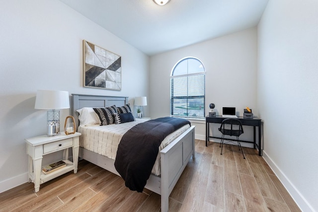 471 Diamondleaf Dr, Buda, TX 78610 - bedroom with light wood finished floors, baseboards, and an office area