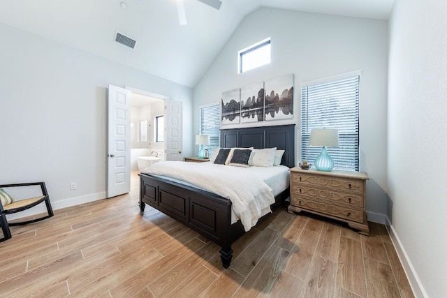 471 Diamondleaf Dr, Buda, TX 78610 - bedroom with light wood-style floors, baseboards, high vaulted ceiling, ensuite bath, and ceiling fan