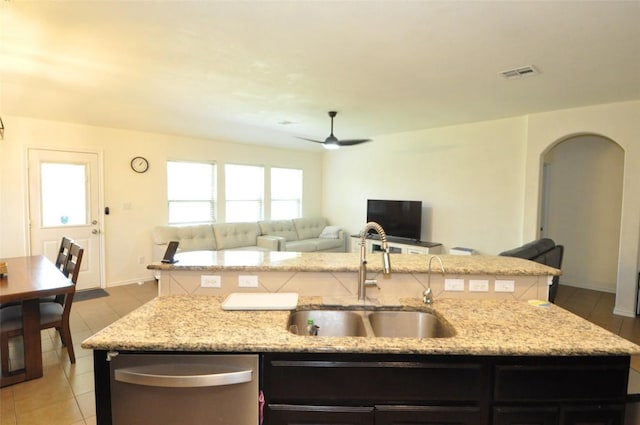 16805 Ruggio Rd, Pflugerville, TX 78660 - kitchen with dishwasher, a center island with sink, a sink, and open floor plan