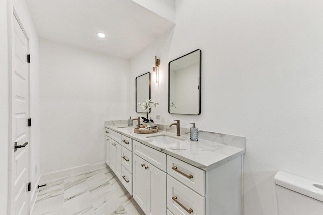 1111 Spearson Ln, Austin, TX 78745 - bathroom with double vanity, marble look tiles, and recessed lighting