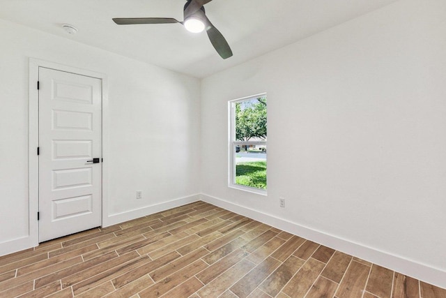 1111 Spearson Ln, Austin, TX 78745 - empty room featuring wood finished floors, a ceiling fan, and a smoke detector