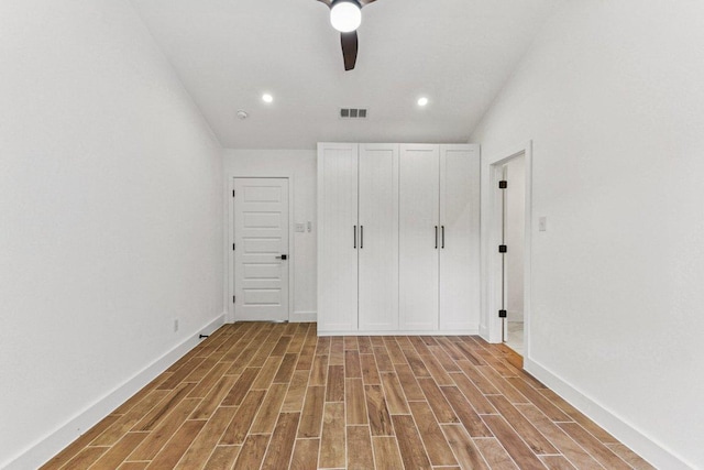 1111 Spearson Ln, Austin, TX 78745 - unfurnished bedroom with wood finished floors, recessed lighting, and a ceiling fan