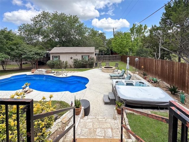 729 Trail Crest Dr, Canyon Lake, TX 78133 - view of swimming pool featuring an outdoor fire pit, a patio, a fenced backyard, and an outdoor structure