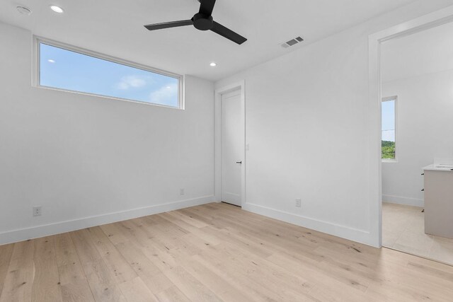 1119 Fairmount Ave, Austin, TX 78704 - unfurnished bedroom with light wood-style flooring, recessed lighting, multiple windows, baseboards, and ceiling fan