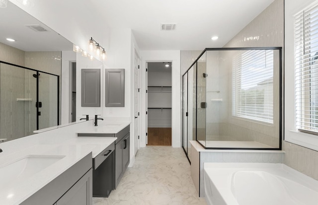 217 Peach Orchard Ln, Georgetown, TX 78628 - bathroom with a shower stall, double vanity, a garden tub, and recessed lighting