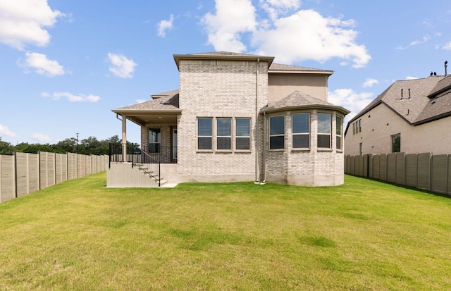 217 Peach Orchard Ln, Georgetown, TX 78628 - back of property featuring brick siding and a fenced backyard