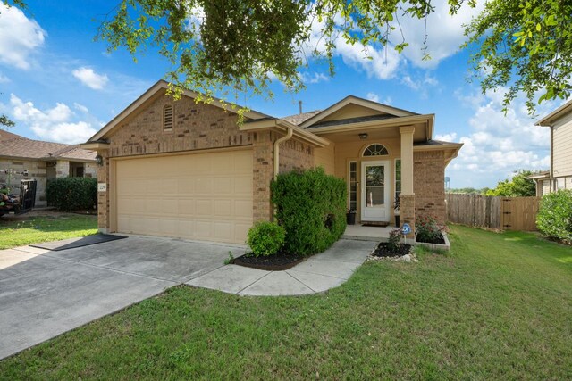 229 Wild Plum, San Marcos, TX 78666 - single story home featuring brick siding, an attached garage, and driveway