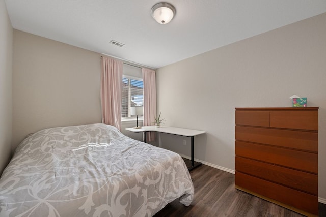 229 Wild Plum, San Marcos, TX 78666 - bedroom with dark wood-type flooring and baseboards