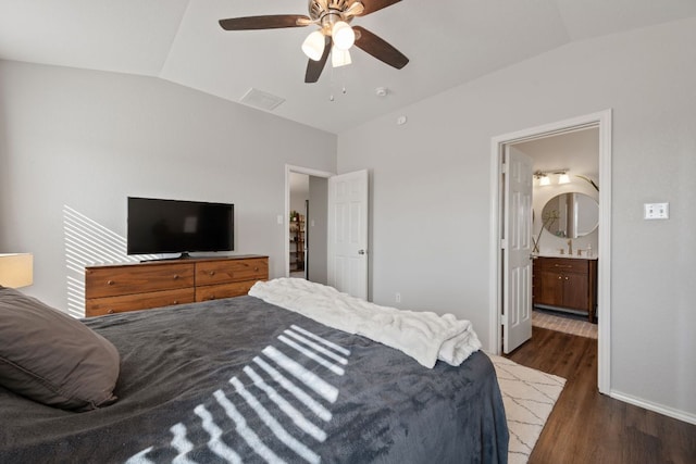 229 Wild Plum, San Marcos, TX 78666 - bedroom featuring vaulted ceiling, wood finished floors, a ceiling fan, and connected bathroom