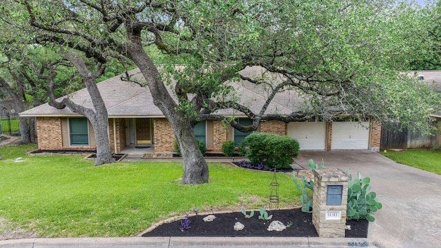 11311 Alhambra Dr, Austin, TX 78759 - view of front of property featuring brick siding and driveway