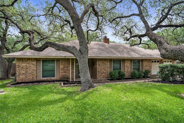 11311 Alhambra Dr, Austin, TX 78759 - ranch-style home with brick siding, a front lawn, and a chimney