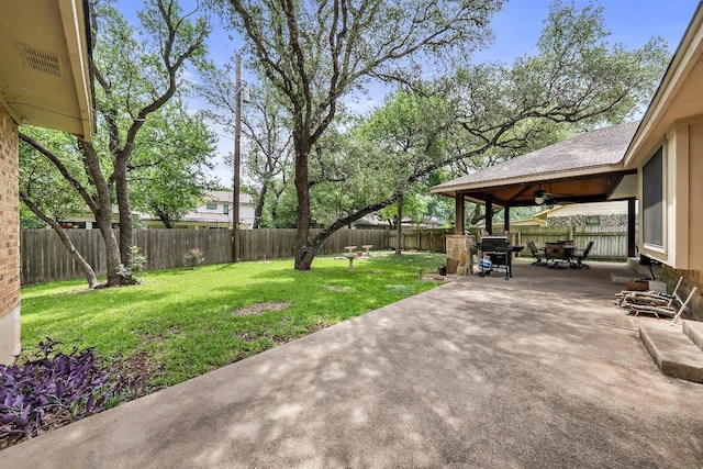 11311 Alhambra Dr, Austin, TX 78759 - fenced backyard with a patio area, a ceiling fan, and outdoor dining space