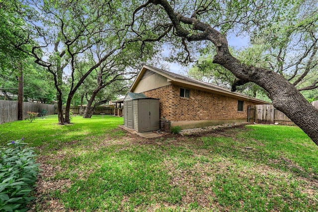 11311 Alhambra Dr, Austin, TX 78759 - view of property exterior with a fenced backyard, brick siding, and a shed