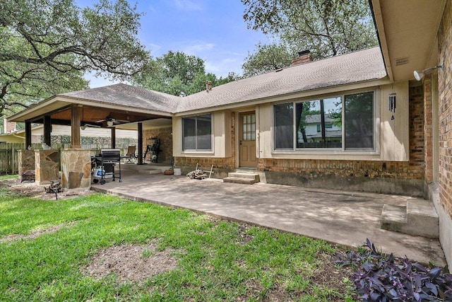 11311 Alhambra Dr, Austin, TX 78759 - back of house with entry steps, a chimney, a patio, a ceiling fan, and brick siding