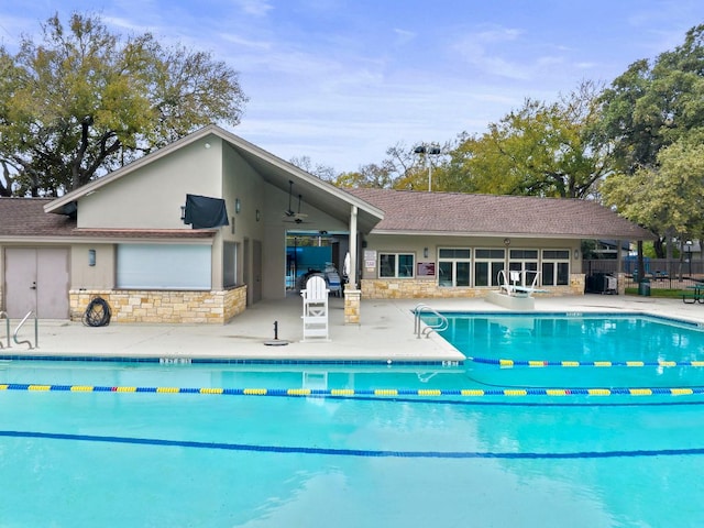 11311 Alhambra Dr, Austin, TX 78759 - community pool featuring a patio area and ceiling fan