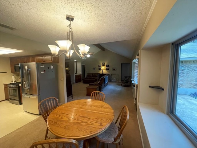 11311 Alhambra Dr, Austin, TX 78759 - dining room with light carpet, vaulted ceiling, a textured ceiling, and a chandelier