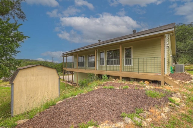 1219 Canyon Trce, Canyon Lake, TX 78133 - rear view of house with a storage shed