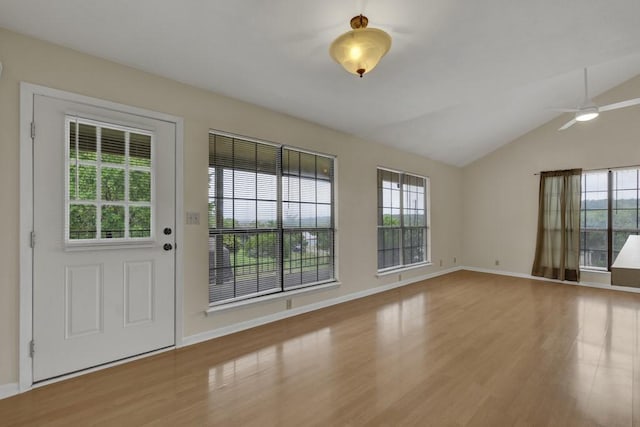 1219 Canyon Trce, Canyon Lake, TX 78133 - spare room featuring wood finished floors, ceiling fan, and vaulted ceiling