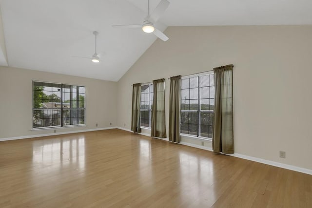 1219 Canyon Trce, Canyon Lake, TX 78133 - spare room featuring ceiling fan, high vaulted ceiling, and wood finished floors