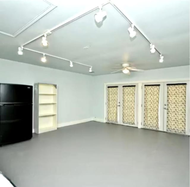 507 Dusty Leather Ct, Pflugerville, TX 78660 - unfurnished living room with track lighting, a ceiling fan, and finished concrete floors