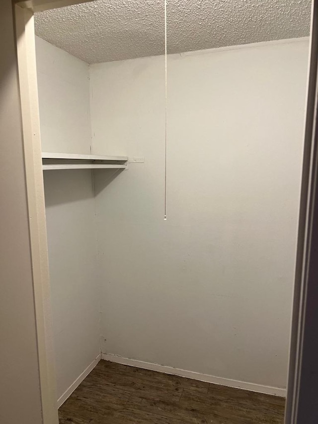 1010 Wayne Dr, Round Rock, TX 78664 - spacious closet with dark wood finished floors