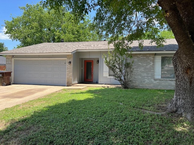 1010 Wayne Dr, Round Rock, TX 78664 - ranch-style house featuring brick siding, a garage, and a front yard
