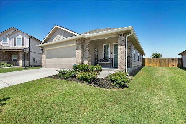 101 Calgary Ln, San Marcos, TX 78666 - view of front of home featuring a garage, covered porch, and concrete driveway