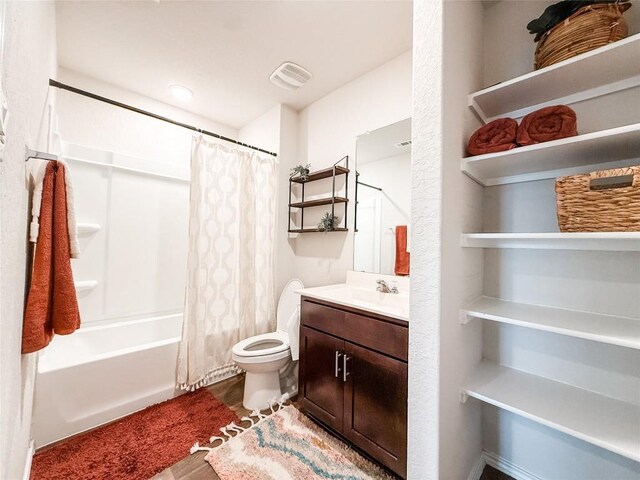 101 Calgary Ln, San Marcos, TX 78666 - bathroom featuring vanity, shower / bath combo with shower curtain, and wood finished floors