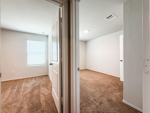101 Calgary Ln, San Marcos, TX 78666 - hall with carpet floors and a textured ceiling