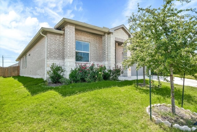 116 Charles Trl, Georgetown, TX 78626 - view of home's exterior with brick siding, stone siding, and concrete driveway