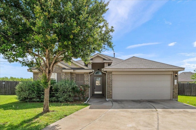 14513 Martial Eagle Dr, Elgin, TX 78621 - single story home with brick siding, concrete driveway, and a garage