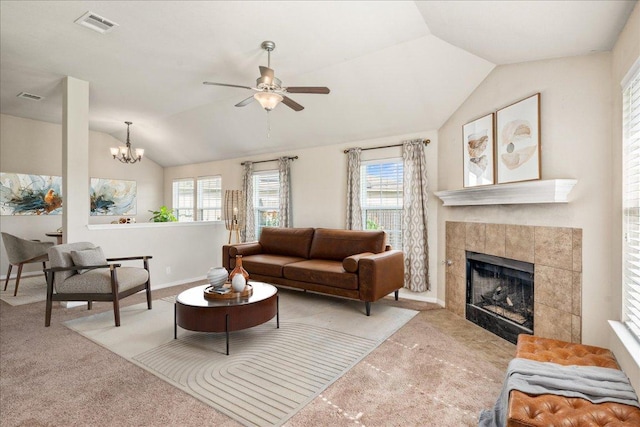 14513 Martial Eagle Dr, Elgin, TX 78621 - living area featuring lofted ceiling, carpet, a fireplace, ceiling fan, and plenty of natural light