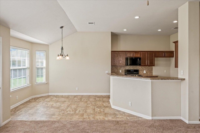 14513 Martial Eagle Dr, Elgin, TX 78621 - kitchen featuring black microwave, stove, decorative backsplash, a chandelier, and hanging light fixtures
