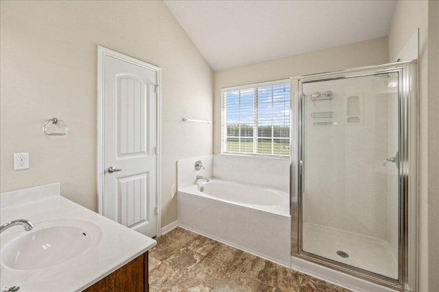 14513 Martial Eagle Dr, Elgin, TX 78621 - bathroom featuring a bath, a shower stall, vaulted ceiling, and vanity