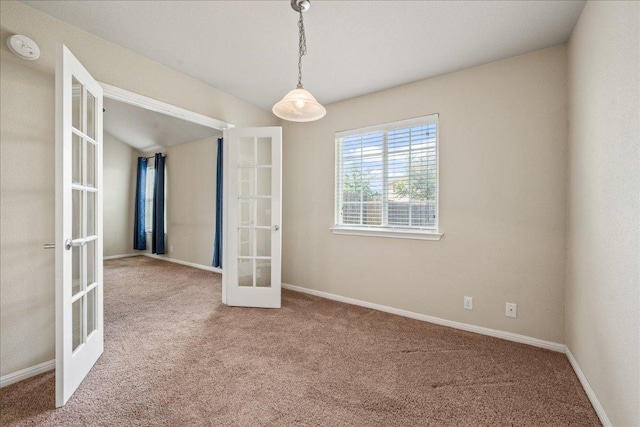 14513 Martial Eagle Dr, Elgin, TX 78621 - unfurnished room with french doors, carpet flooring, and a smoke detector