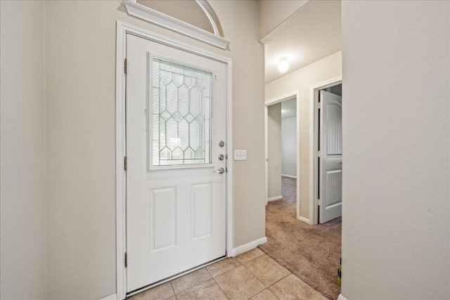 14513 Martial Eagle Dr, Elgin, TX 78621 - entrance foyer with light tile patterned flooring and light carpet