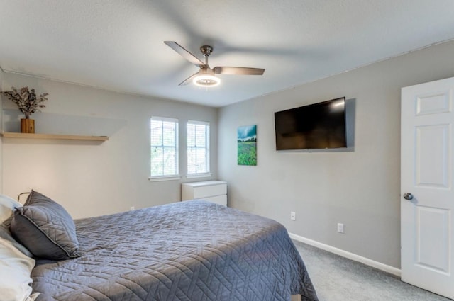 2529 Rio Grande St Unit 51, Austin, TX 78705 - carpeted bedroom with baseboards and a ceiling fan