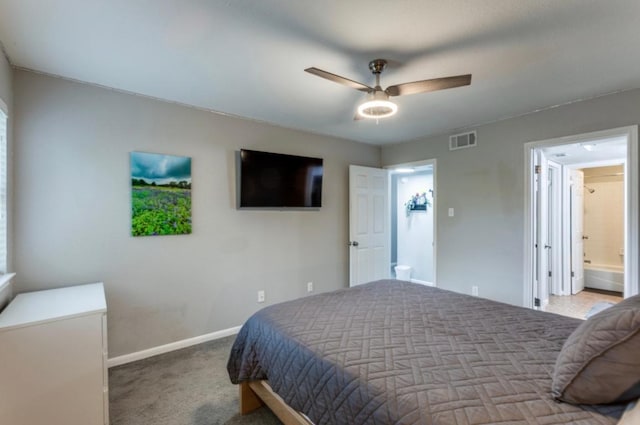 2529 Rio Grande St Unit 51, Austin, TX 78705 - carpeted bedroom with baseboards, ceiling fan, and ensuite bath