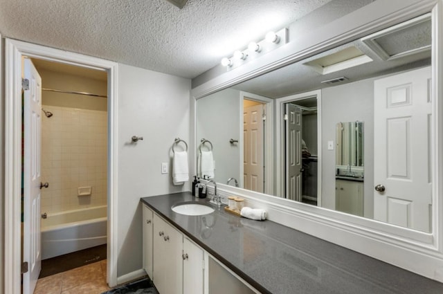 2529 Rio Grande St Unit 51, Austin, TX 78705 - full bathroom featuring vanity, shower / tub combination, tile patterned floors, and a textured ceiling