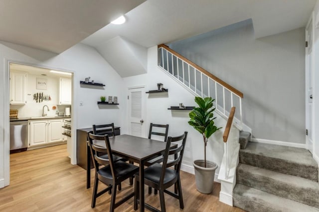 2529 Rio Grande St Unit 51, Austin, TX 78705 - dining room with stairway, light wood-style flooring, and vaulted ceiling