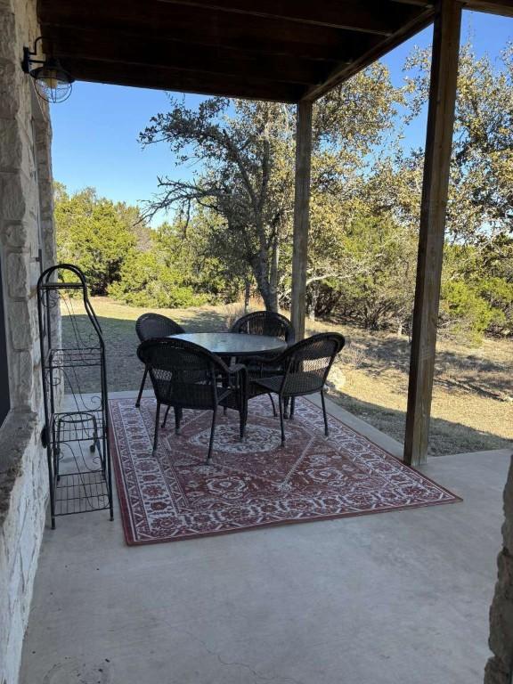 18220 Shepherds Corral, Dripping Springs, TX 78620 - view of patio / terrace featuring outdoor dining space