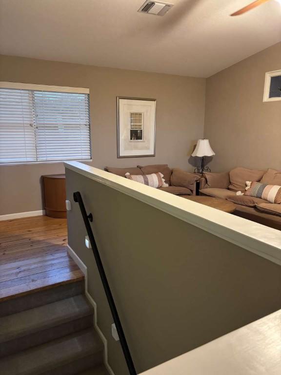 18220 Shepherds Corral, Dripping Springs, TX 78620 - staircase featuring wood finished floors and baseboards