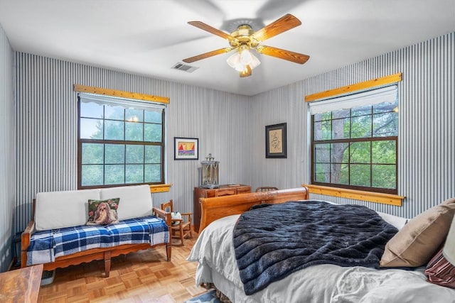 220 River Rapids Rd, Wimberley, TX 78676 - bedroom with wallpapered walls and a ceiling fan
