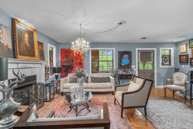 220 River Rapids Rd, Wimberley, TX 78676 - living area with a chandelier, baseboards, and a fireplace