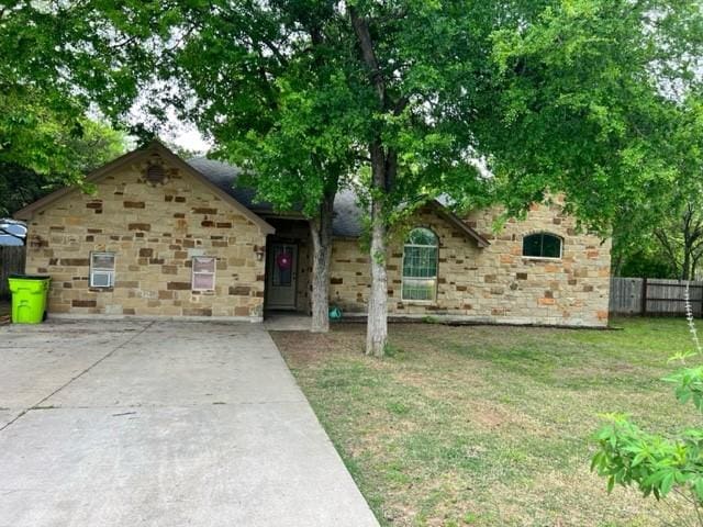 1375 Lovers Ln, Bastrop, TX 78602 - view of front facade featuring stone siding and concrete driveway