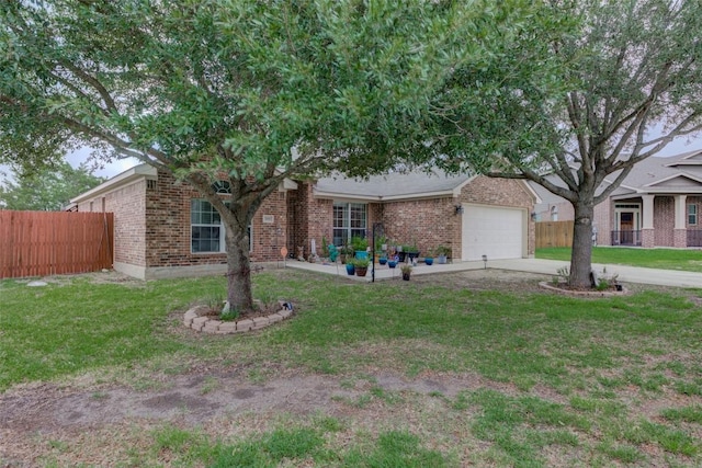 700 Indian Blanket St, Lockhart, TX 78644 - view of front of house featuring brick siding, a garage, and concrete driveway