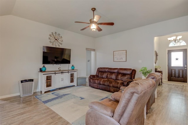 700 Indian Blanket St, Lockhart, TX 78644 - living area with wood finished floors, a chandelier, ceiling fan, and vaulted ceiling