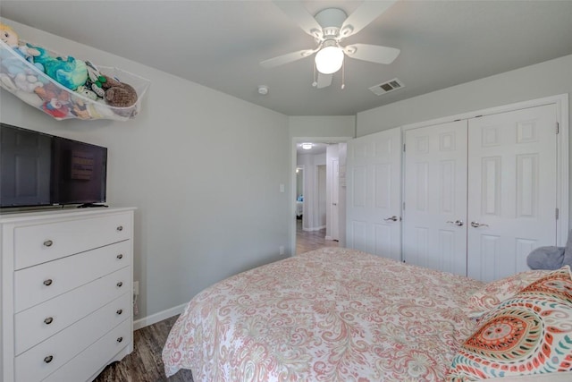 700 Indian Blanket St, Lockhart, TX 78644 - bedroom featuring a closet, wood finished floors, and a ceiling fan