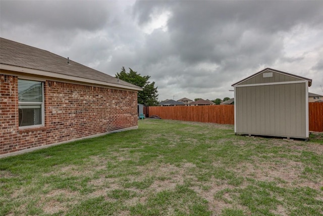 700 Indian Blanket St, Lockhart, TX 78644 - fenced backyard with a storage unit