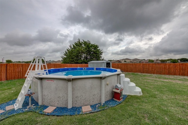 700 Indian Blanket St, Lockhart, TX 78644 - view of swimming pool featuring a fenced backyard and a shed